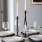 close view of a table set with candles and dinnerware