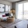 living room with a couch and large windows