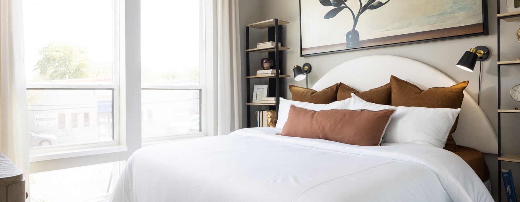 bedroom with large window and bed