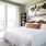 bedroom with large window and bed