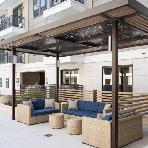Relax and unwind poolside lounge area with ample seating next to the pool