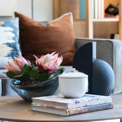 Make this space your own close up of a coffee table with decorations